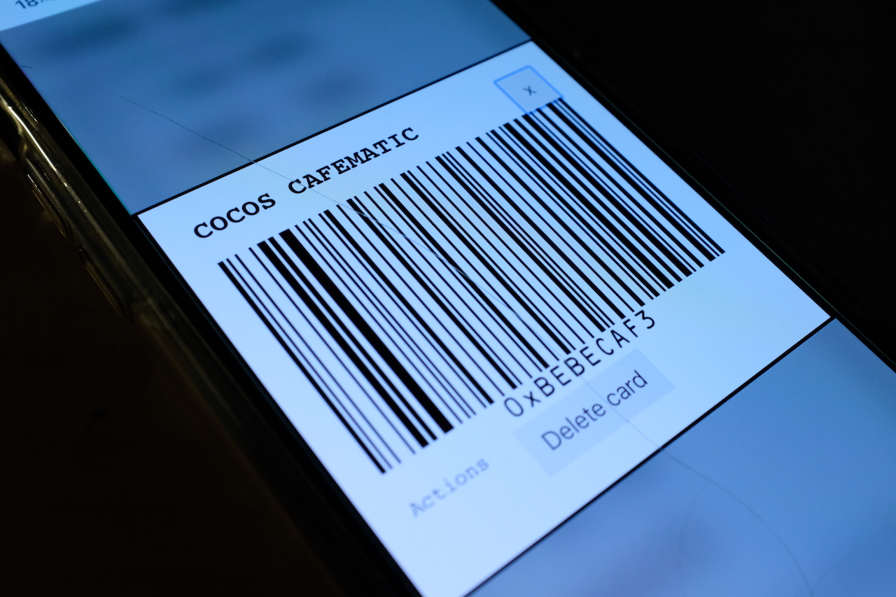 image of phone screen showing a card barcode being rendered, it says coco's cafe